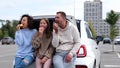 Caucasian joyful family woman and man with teenager girl smiling doing cheers gesture with donuts in hands. Parents with Royalty Free Stock Photo