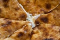 Caucasian khychin bread pie with meat close.