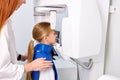 kid girl patient doing panoramic teeth x-ray orthopantomography in clinic Royalty Free Stock Photo