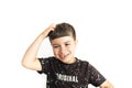 Caucasian kid making hesitant gesture on white background