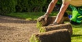 Planting Natural Grass Turfs on a Newly Prepared Soil Royalty Free Stock Photo