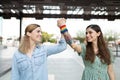 Gay friends raising their arms and wearing rainbow wristbands Royalty Free Stock Photo