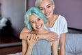 Caucasian lesbian LGBT Couple warm hug on bed in bedroom with laughing moment Royalty Free Stock Photo