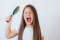 Caucasian little cute girl unhappy with very long hair, portrait