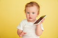 Caucasian little girl, children isolated on yellow studio background Royalty Free Stock Photo