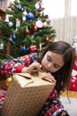 Caucasian little girl opening a Christmas Day present at home Royalty Free Stock Photo