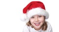 Caucasian little girl portrait in Santa hat. Child in Christmas hat isolated white background Royalty Free Stock Photo