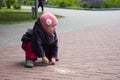 Caucasian little girl of three years old drawing with chalk on the ground outdoor Royalty Free Stock Photo