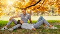 Caucasian lover couple having romance moment in park together during autumn season