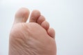 Caucasian male bare feet. Close up shot, isolated on white background, bottom view of bare sole