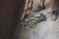 Caucasian male builder sweeps construction debris. Royalty Free Stock Photo