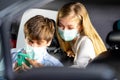 Driver in public transportation taxi wearing face protection mask to prevent disease pandemic