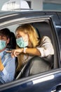 Driver in public trasportation taxi wearing face protection mask to prevent disease pandemic