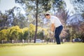 Caucasian male golfer playing a chip shot on a golf course in south africa Royalty Free Stock Photo