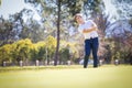 Caucasian male golfer playing a chip shot on a golf course in South Africa Royalty Free Stock Photo