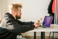 Close-up male guy portrait resting in coffee shop chatting in social networks skilled freelancer enjoying remote job Royalty Free Stock Photo