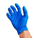 Caucasian male hand in blue latex glove.