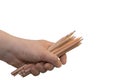 Caucasian male hand holding color pencils