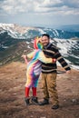 Male hiker meets magic unicorn in mountains