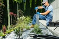 Landscaper Installing the Garden Lamp