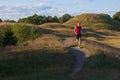 Caucasian, male runner in a summer landscape