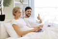 Mature people spending time at home using modern gadgets Royalty Free Stock Photo