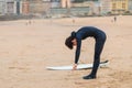 Caucasian male surfer getting ready to go surfing in the ocean