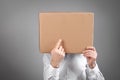 Caucasian man with a cardboard box over his head Royalty Free Stock Photo