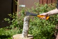 Caucasian man cutting firewood outdoors Royalty Free Stock Photo