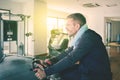 Caucasian man doing workout with gym cycling Royalty Free Stock Photo