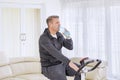 Caucasian man drinking water on a spin bike Royalty Free Stock Photo