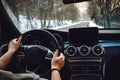 Caucasian man driving car on the empty road, winter and snow background.Caucasian man driving car on the empty road, winter and Royalty Free Stock Photo