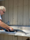 Caucasian man filleting salmon