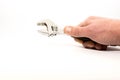 Caucasian man hand holding wrench on white background, Royalty Free Stock Photo