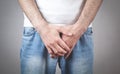 Caucasian man with hands holding his crotch. Inflammation of the prostate, erection problems Royalty Free Stock Photo