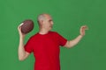 Caucasian man imitating a quarterback