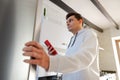 Man checking food in the fridge Royalty Free Stock Photo