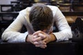 Caucasian man praying in church. He has problems and ask God for help Royalty Free Stock Photo