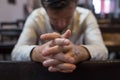 Caucasian man praying in church. He has problems and ask God for help Royalty Free Stock Photo