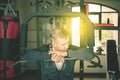 Caucasian man resting on the exercise machine Royalty Free Stock Photo