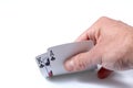 Caucasian man`s hand showing flowers poker cards, ace and king, isolated on white background Royalty Free Stock Photo