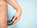 Caucasian man shaving hair from legs Royalty Free Stock Photo