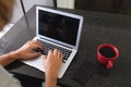 Caucasian man sitting in kitchen using laptop Royalty Free Stock Photo