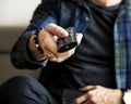 Caucasian man using tv remote controller Royalty Free Stock Photo