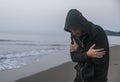 Caucasian man walking alone at the beach Royalty Free Stock Photo