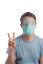 Caucasian man wearing a protection mask and a sleeping mask on a white background