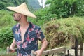 Caucasian man working in Asian farm