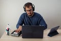 Caucasian man working from home with his cell phone and tablet Royalty Free Stock Photo