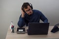 Caucasian man working from home with his cell phone and tablet Royalty Free Stock Photo