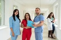 Caucasian medical students wear uniform in corridor of modern clinic Royalty Free Stock Photo